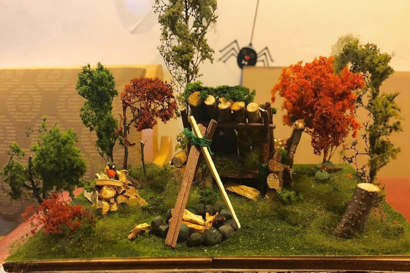 Miniature diorama of a campsite.